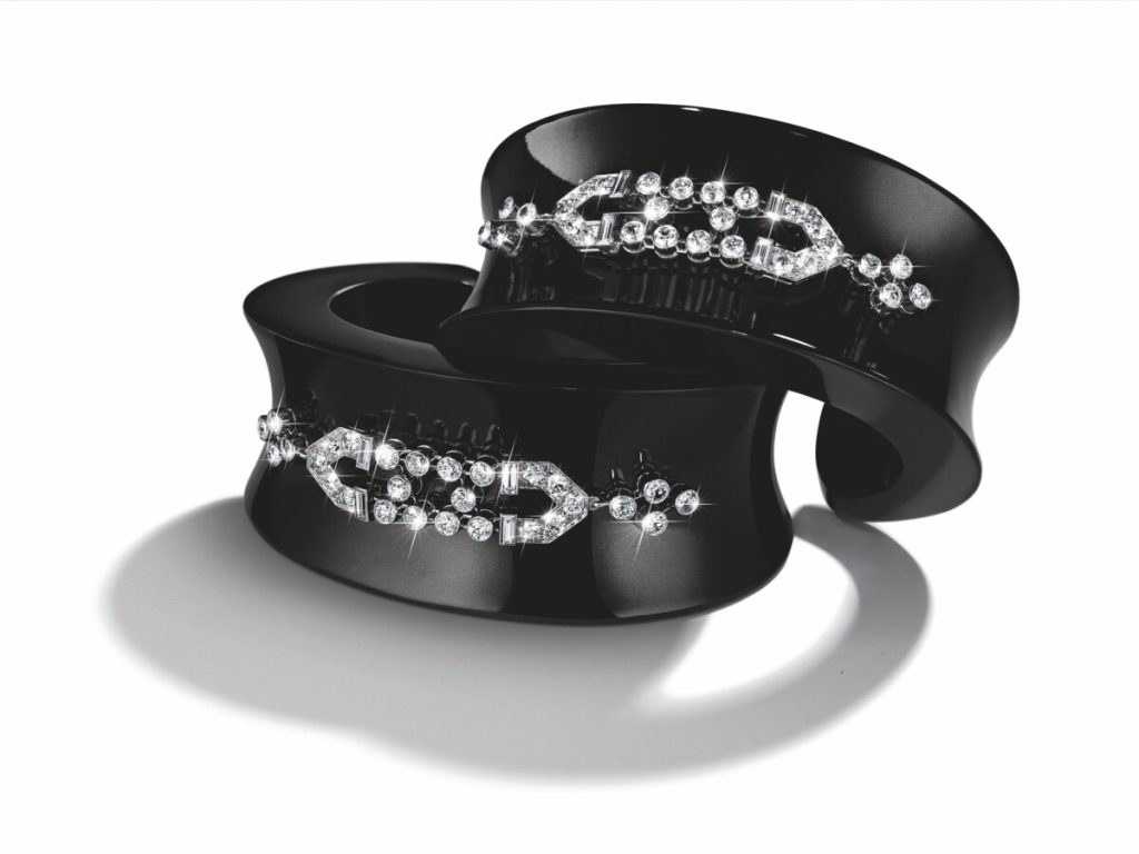 Belperron black jade cuff bracelets with diamond art deco style accents.